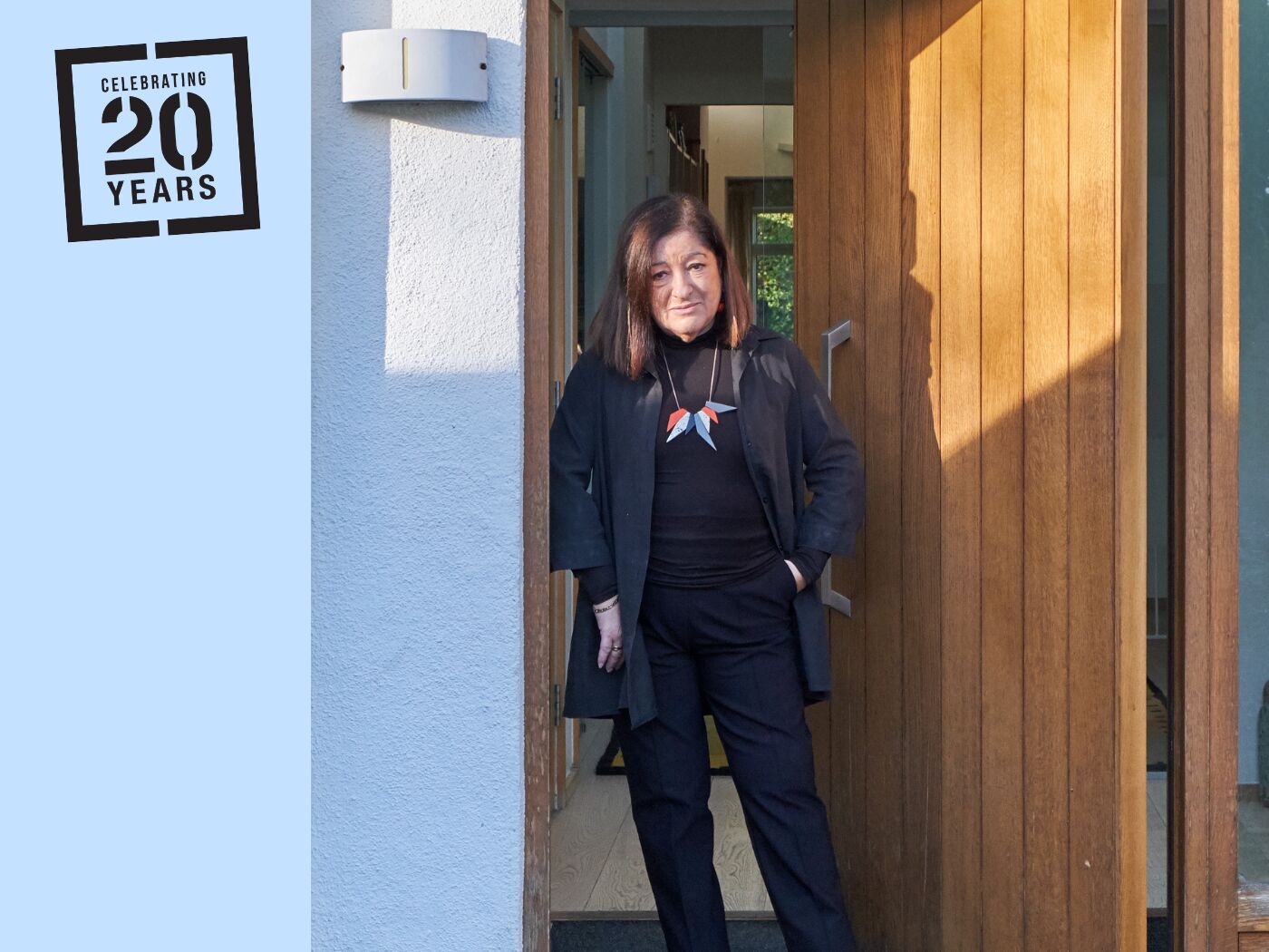 Architect Jane Duncan OBE pictured with her Porto pivot door in oak.