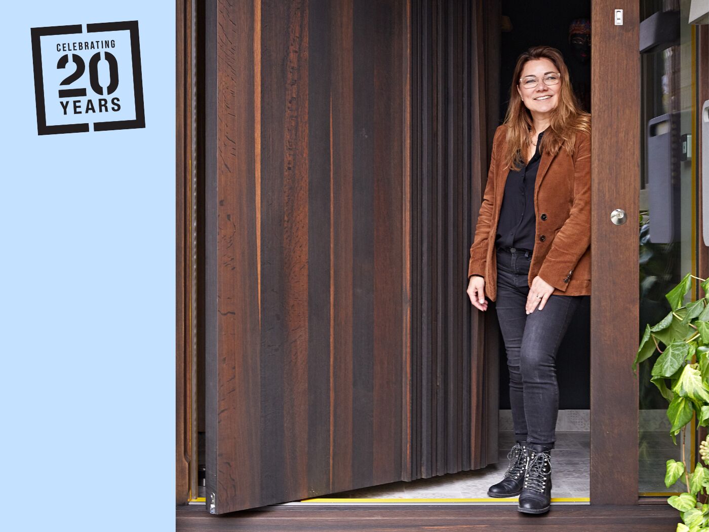 Urban Front co-foundeer Elizabeth Assaf with her Bari door in fumed oak (2021).