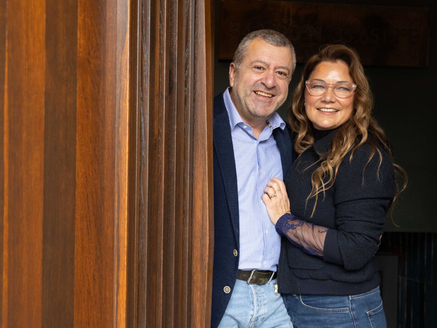 Urban Front founders Nabil and Elizabeth Assaf with their Bari door in fumed oak