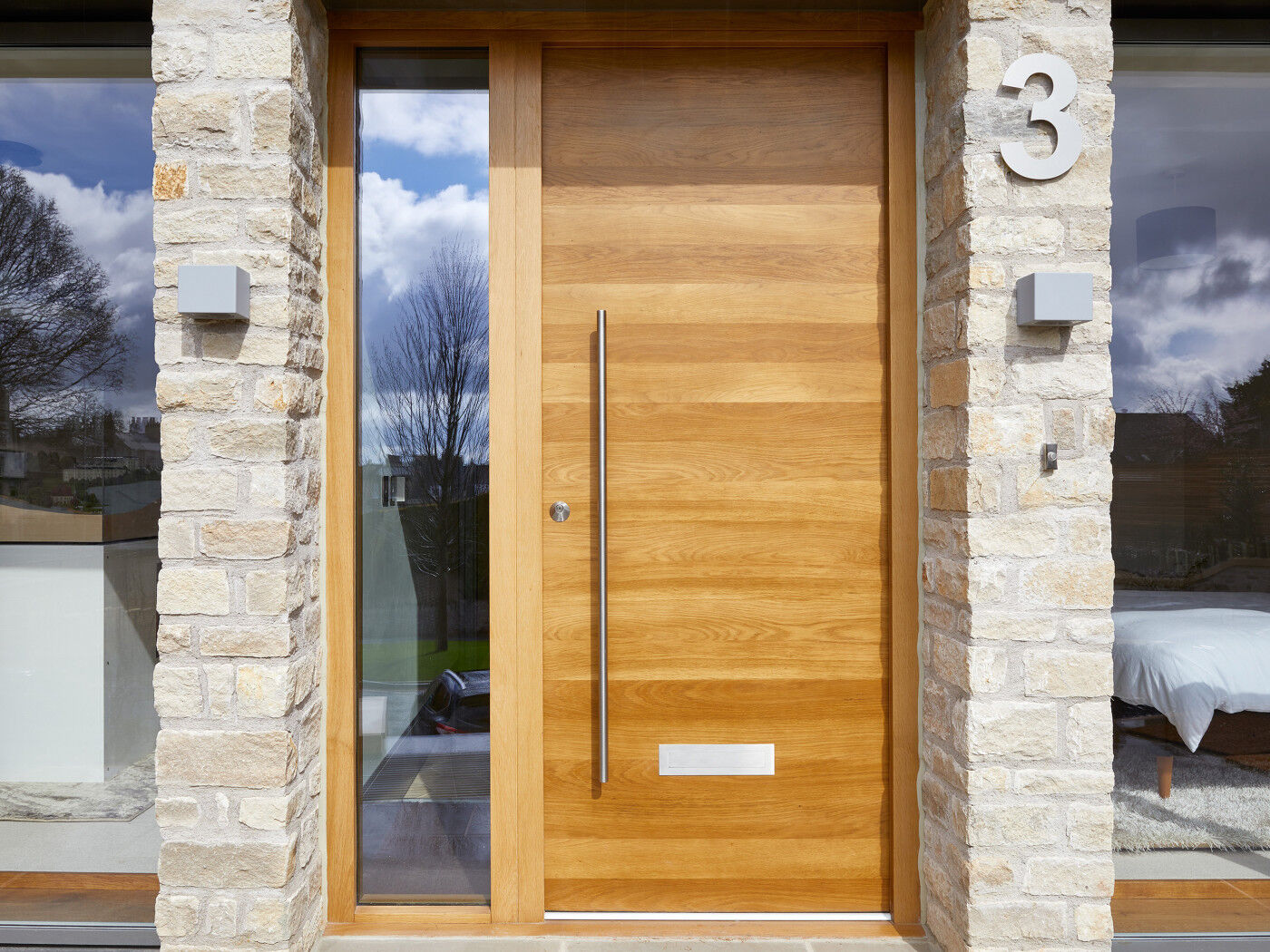 Using a large door number by a simple door creates interest