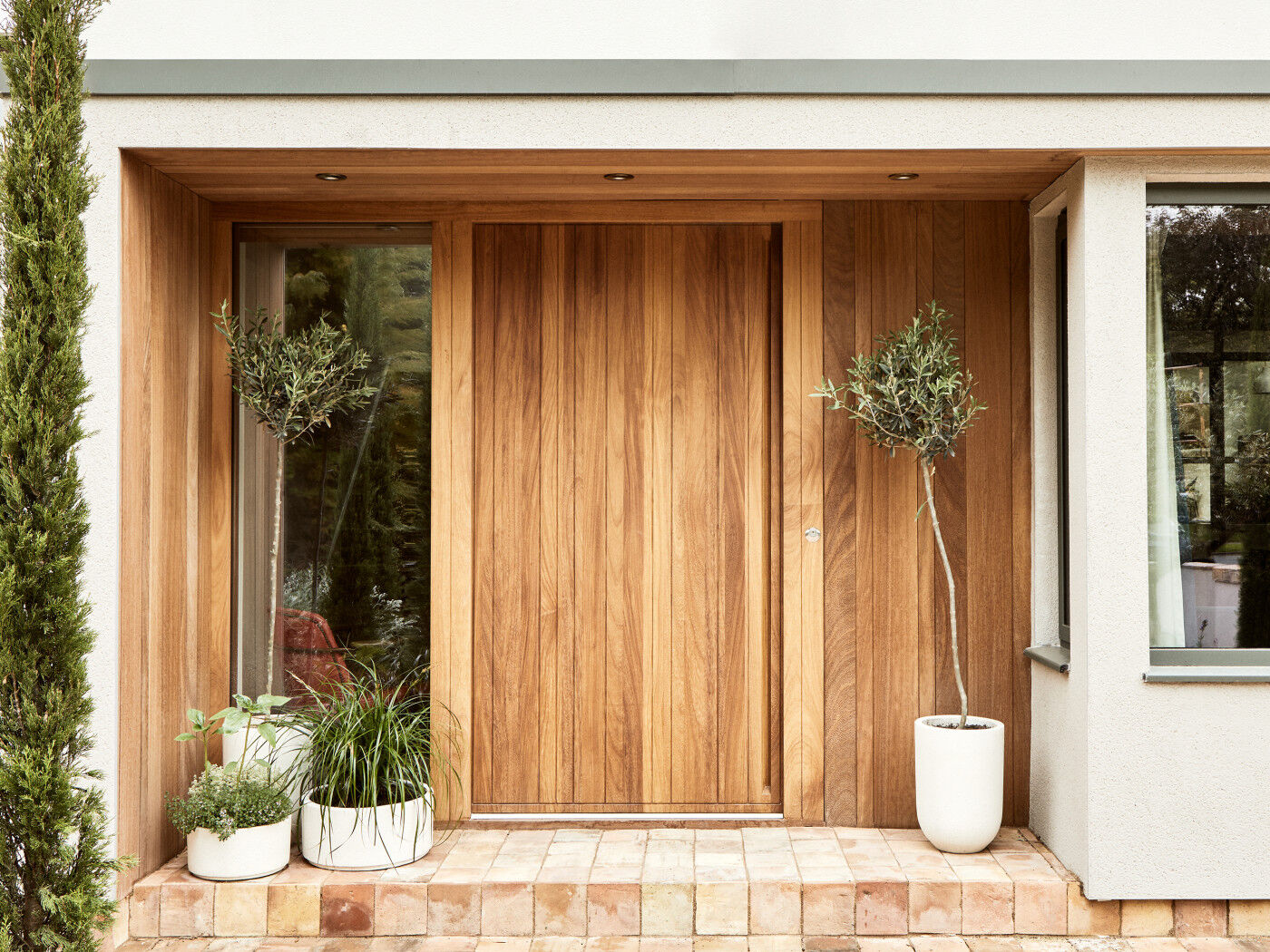 Natural hardwood is the perfect material for statement or understated doors