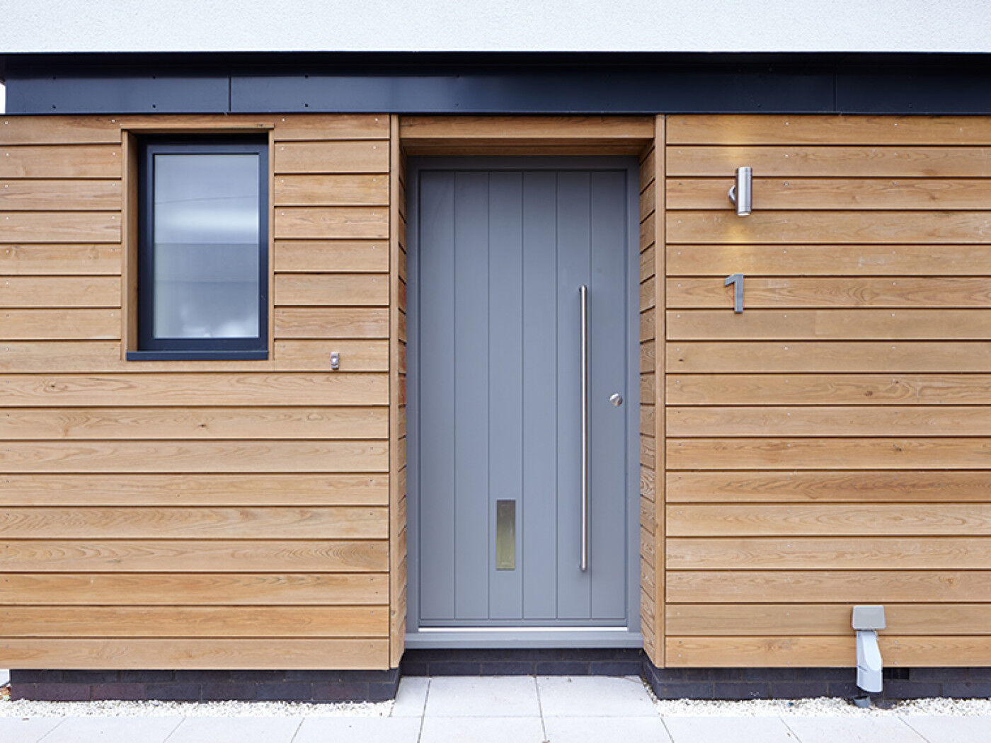 Steel beams, cladding and white render choosing a light grey is safe but also effective