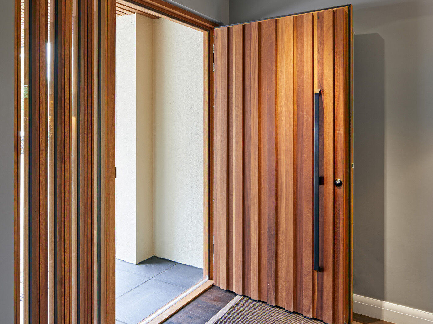 This design can add further interest when combined with a glass side panel, where the raised elements add continuation to the door design 