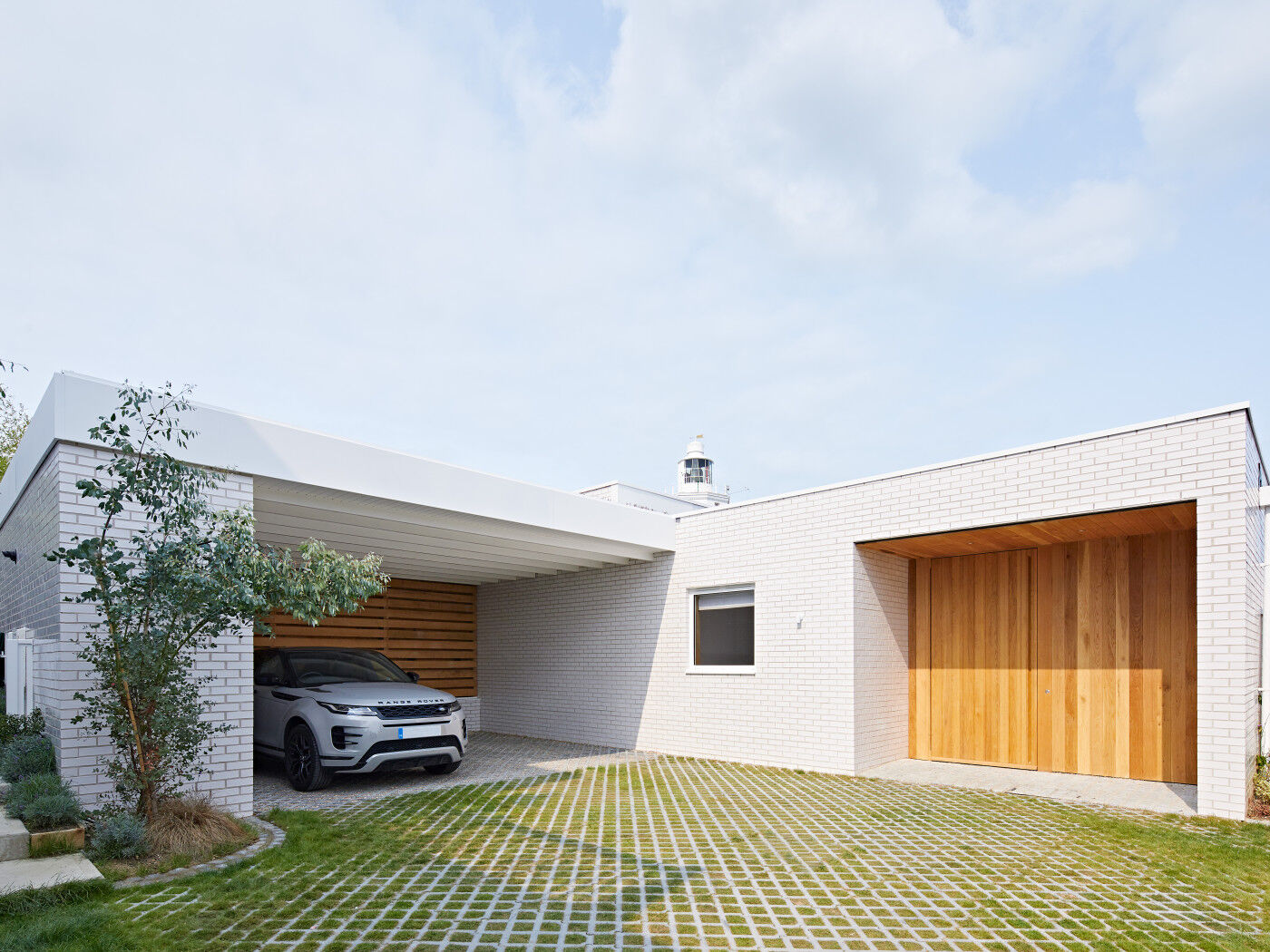 Less is more - minimalist details like concealed handles and simple design blend beautifully with cladding to create an understated entrance