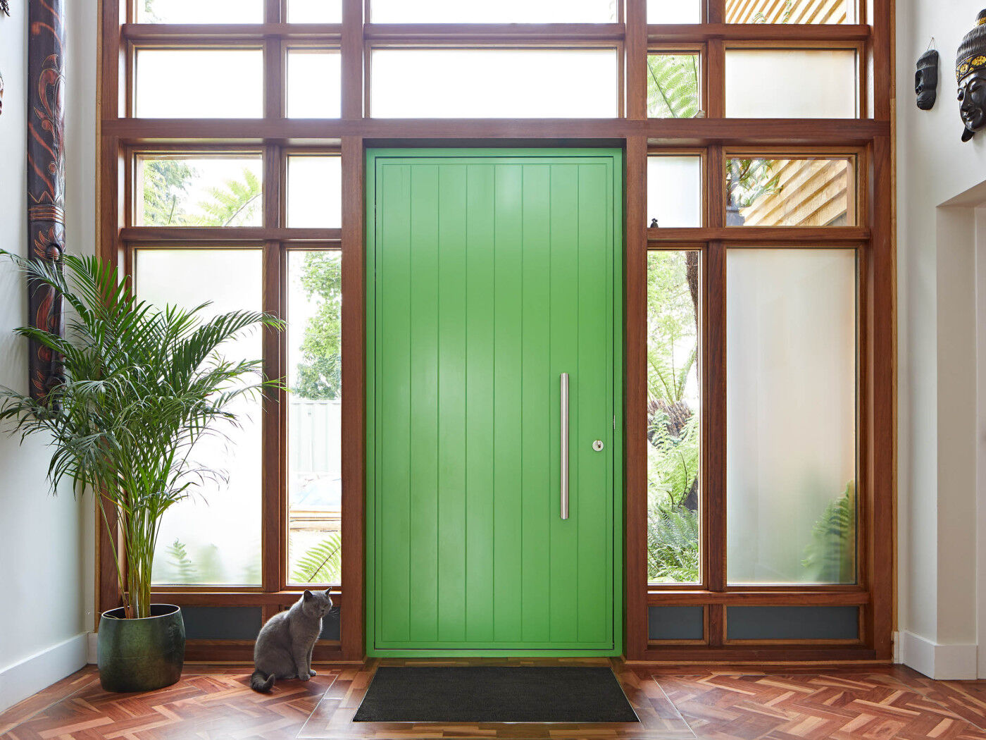 The wood and glass panels make the perfect frame for this colourful door