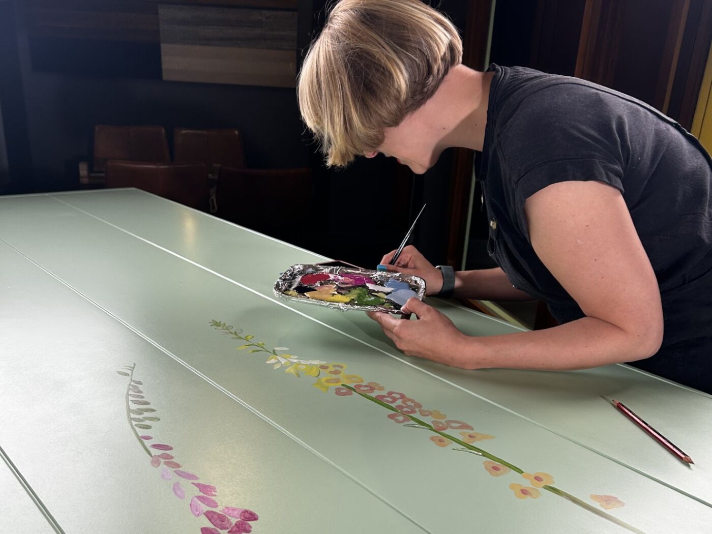 Landscape Emma painting the door