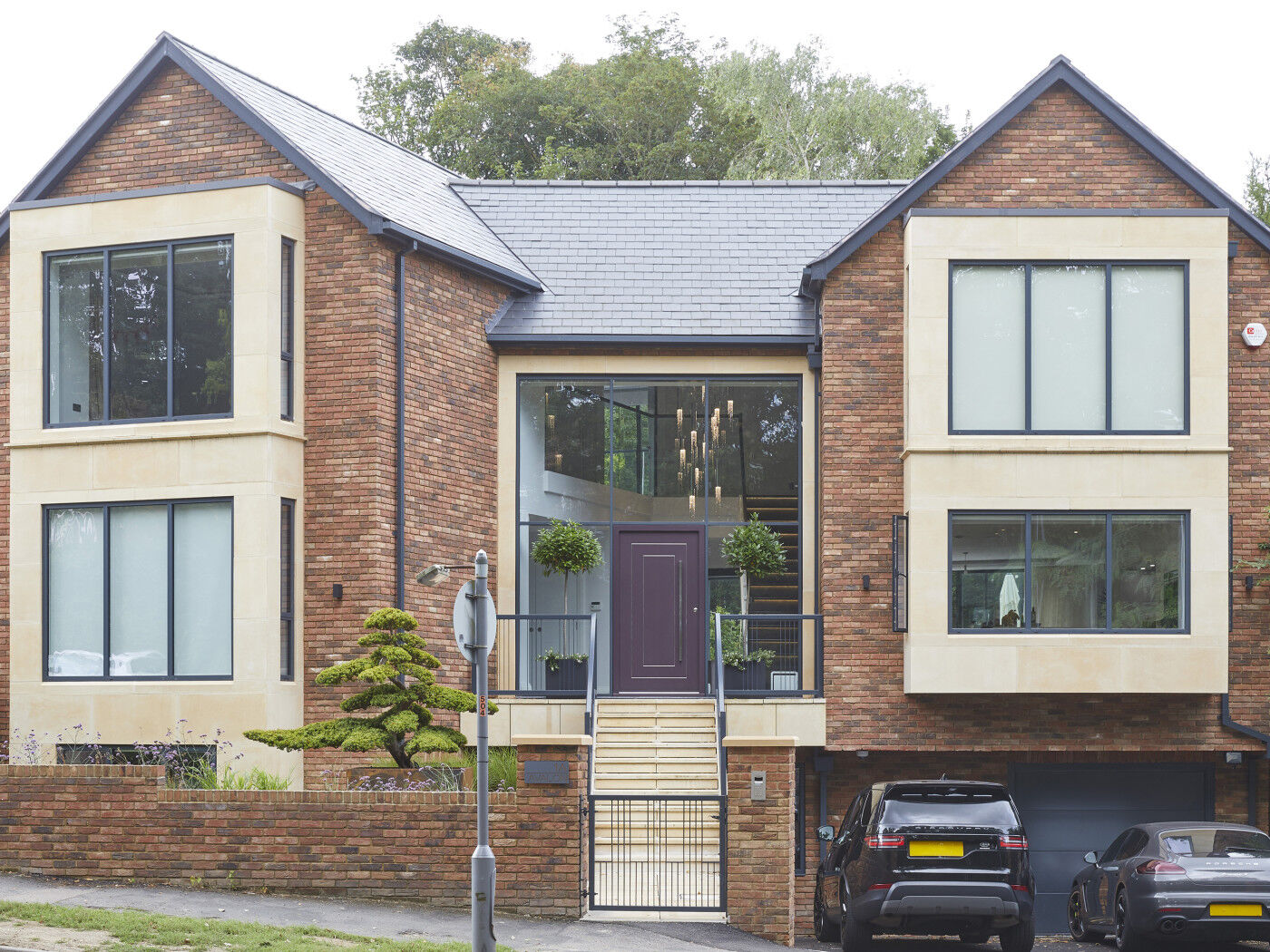The final house in full with its beautiful door - scroll to the next image to see an early CGI rendering with the door in a different colour