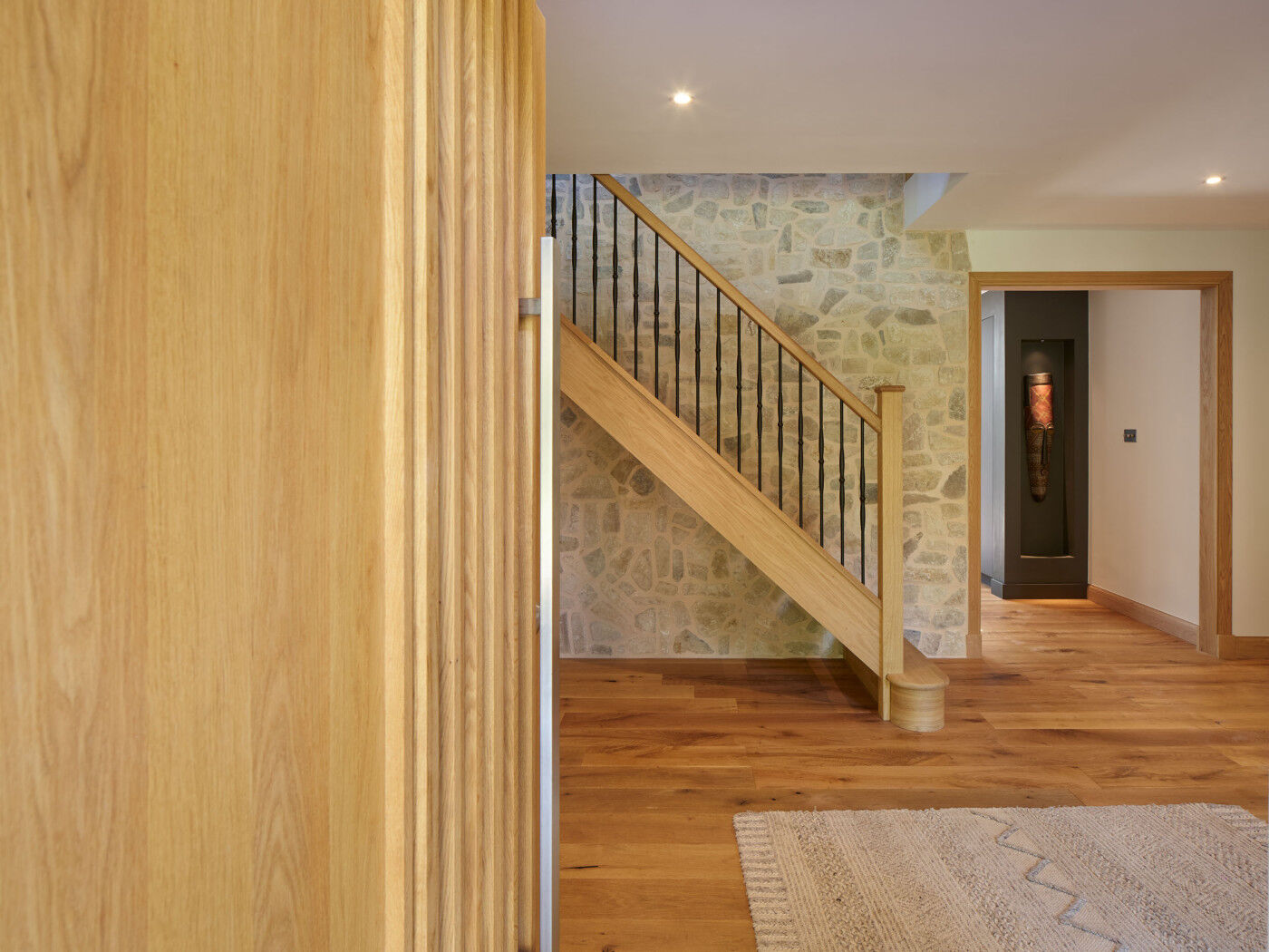 The interior features white, stone and oak elements 