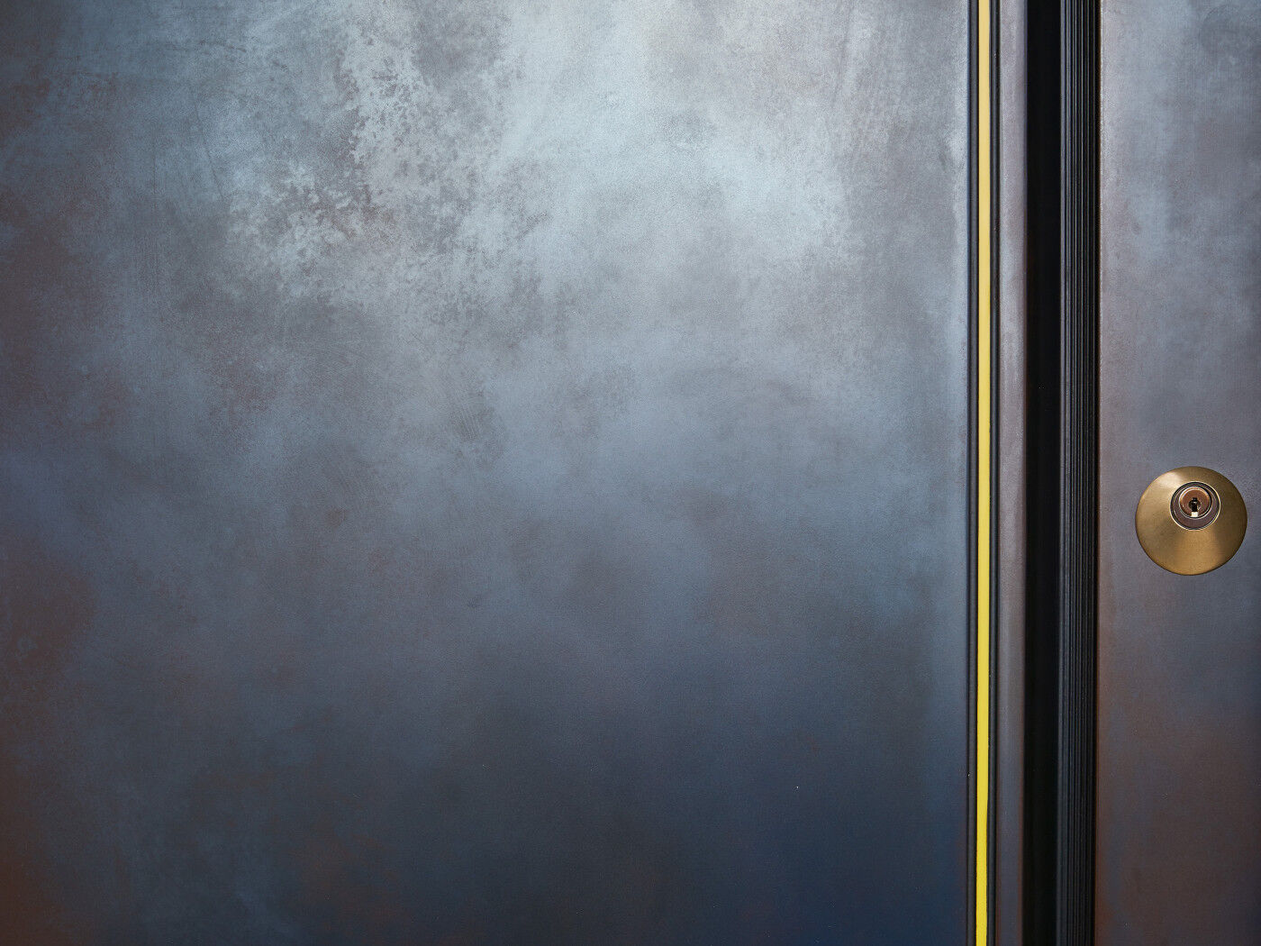 This conecealed handle with a flash of yellow corian adds a bit of fun