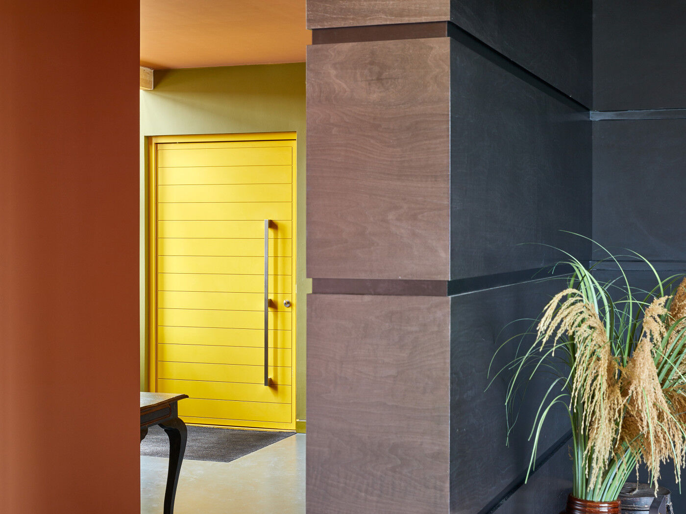 This bright door is complimented by a statement handle