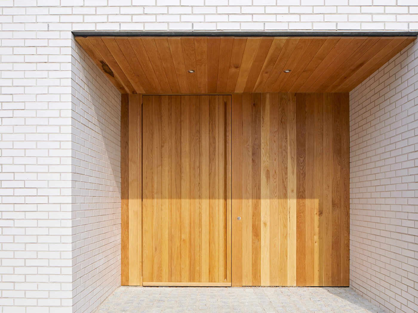 A sizeable canopy or porch is the best way to minimise wood door maintenance