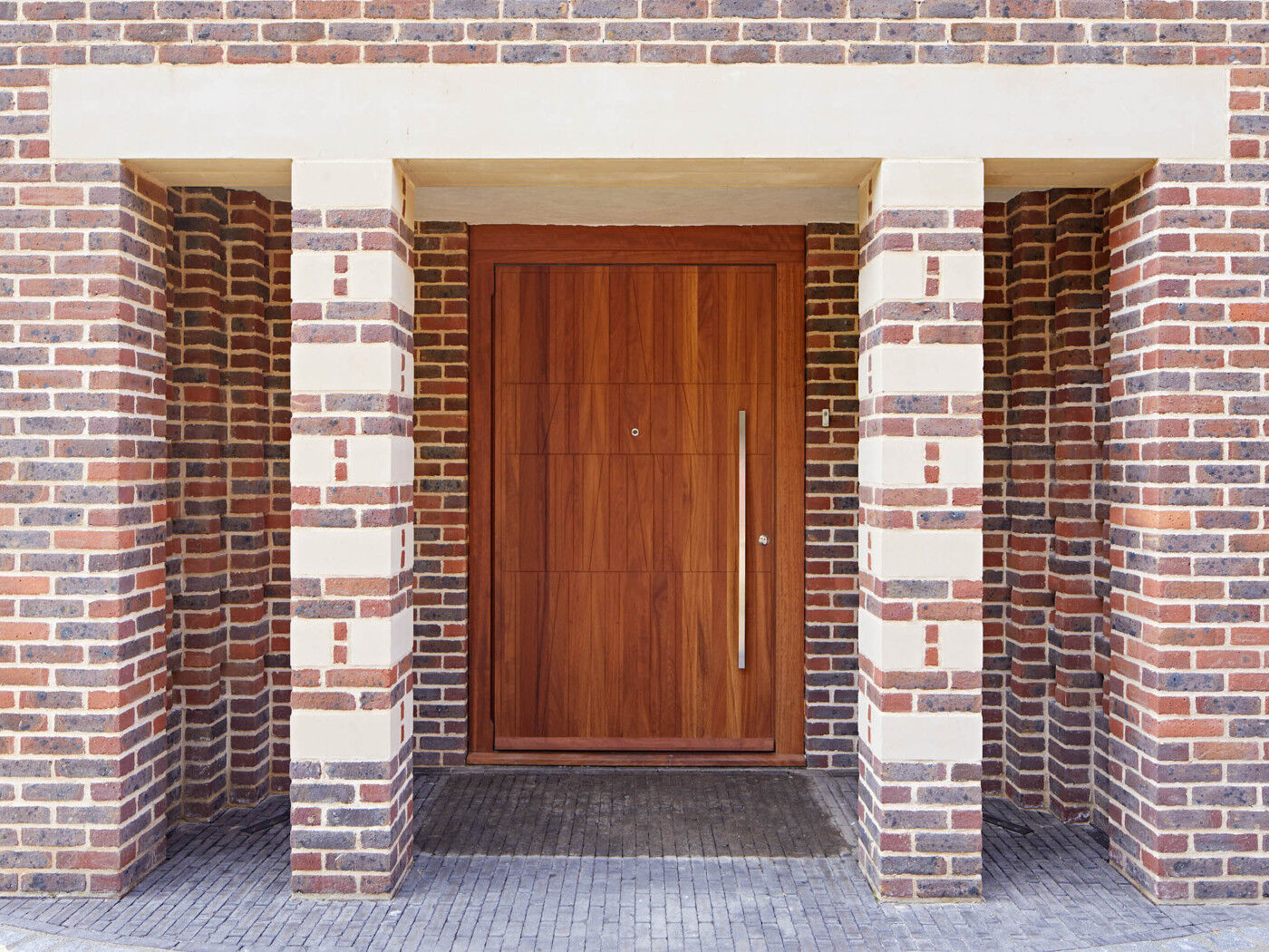 Somewhere between a porch and a canopy - this front door canopy with pillars creates a grand & sheltered entrance way