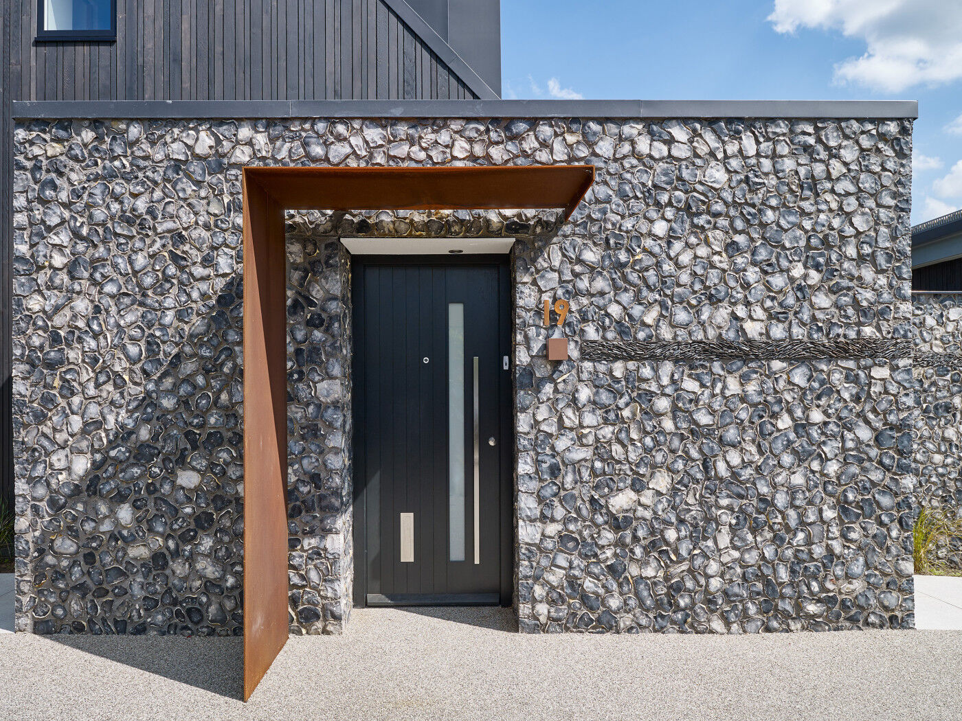 A contrast in material and colour sets this metal canopy apart as a unique design feature