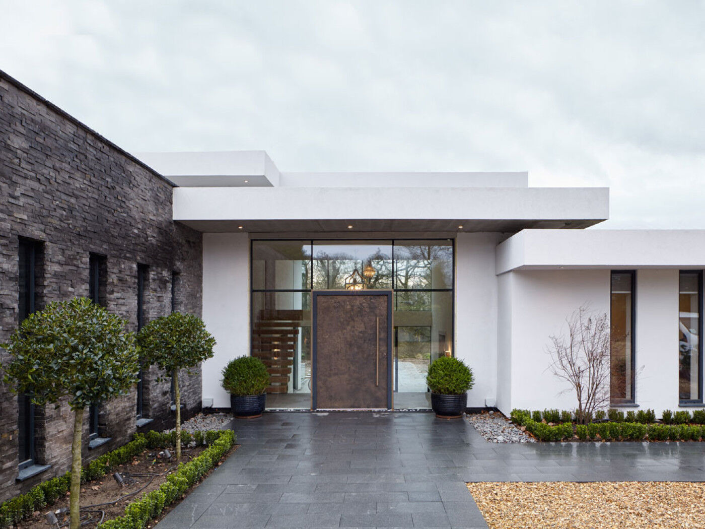  This oversized bronze door is 1.3m wide x 2.4m tall and looks great with the render and brick walls