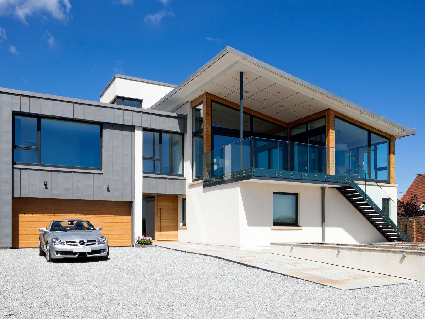 Matching doors work thanks to the glass, render and cladding on this property 