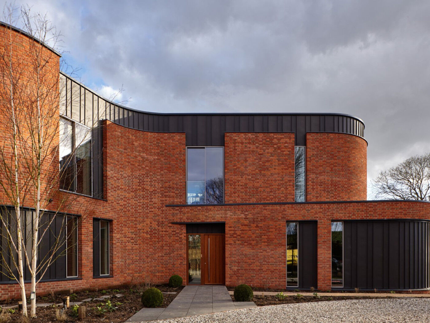 The front door is larger than the back door and has a long pull handle.