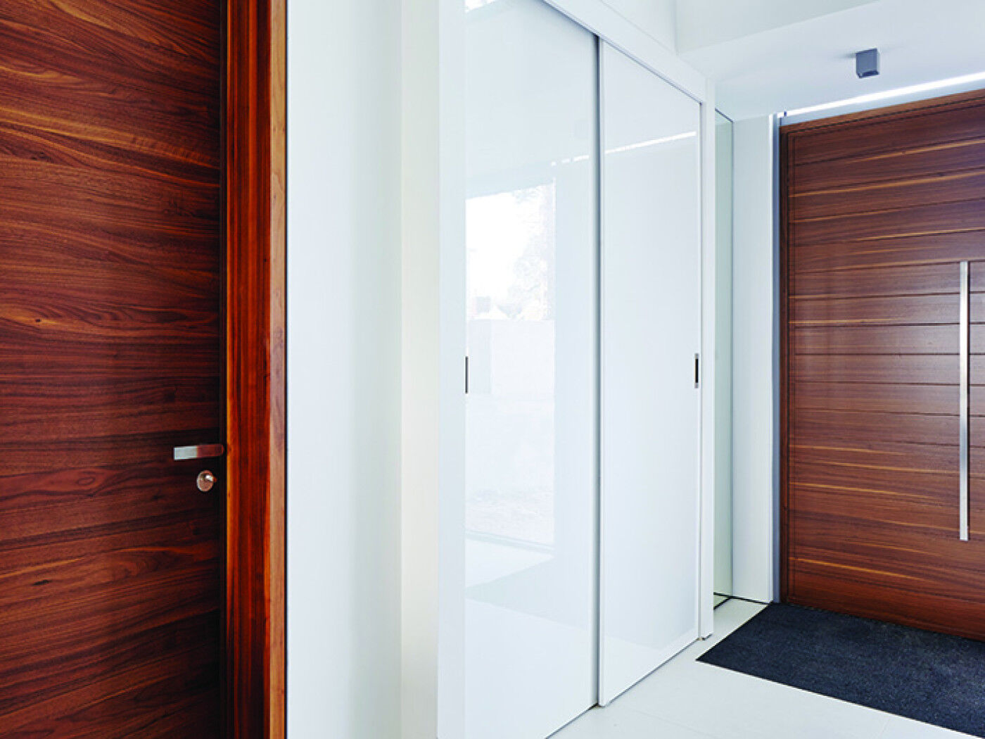 sliding cupboard doors match the wall whilst the front and internal doors are  similar