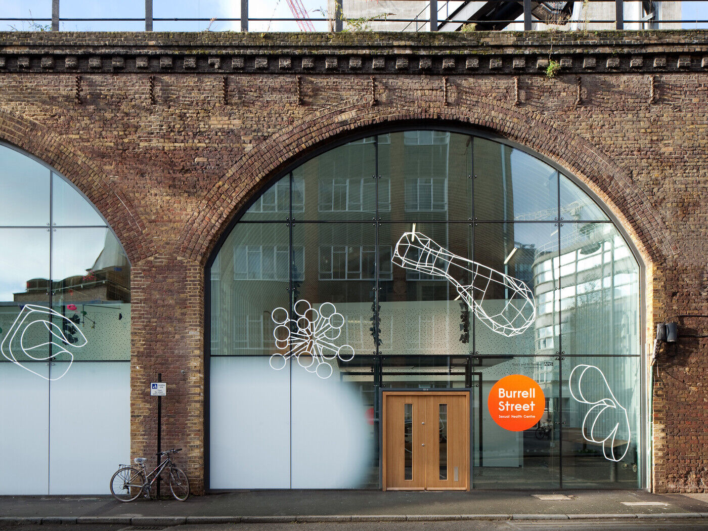 This hospital clinic is a great example of how a door can be dwarfed by glass but still achieve its purpose