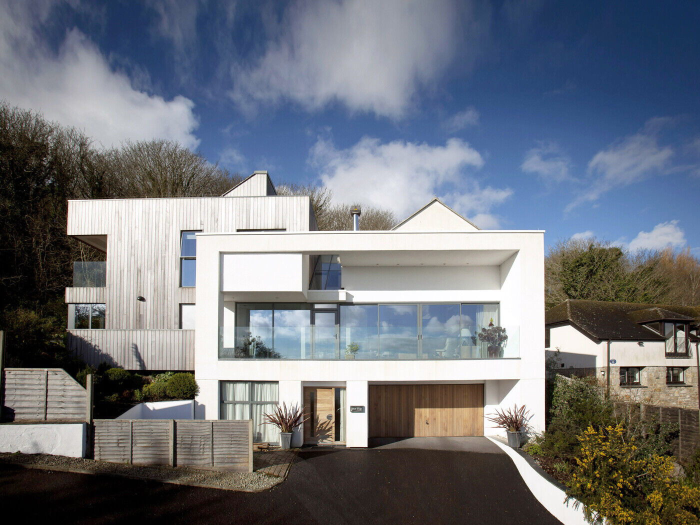 Columns either side of the door prevent the garage from being visually dwarfed by the garage