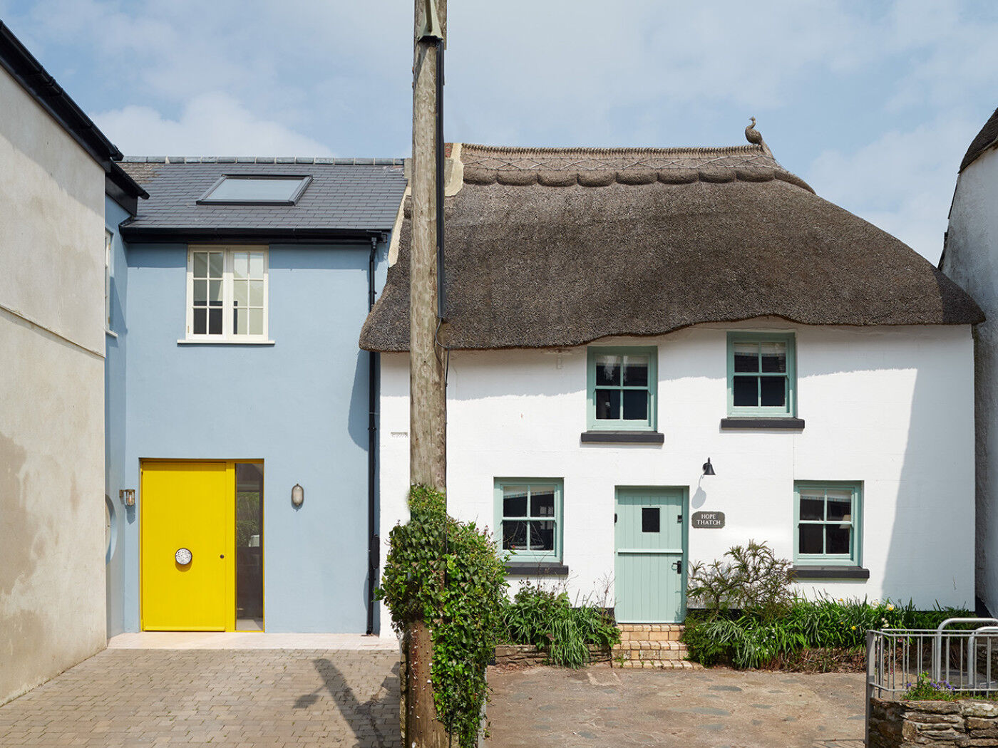 You can't miss the stunning yellow of the bespoke Smurf House door