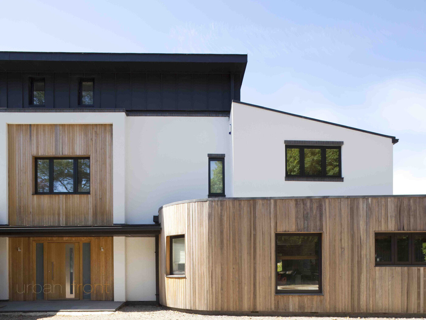 Urban Front's Sorrento V door looks great on this unique curved home