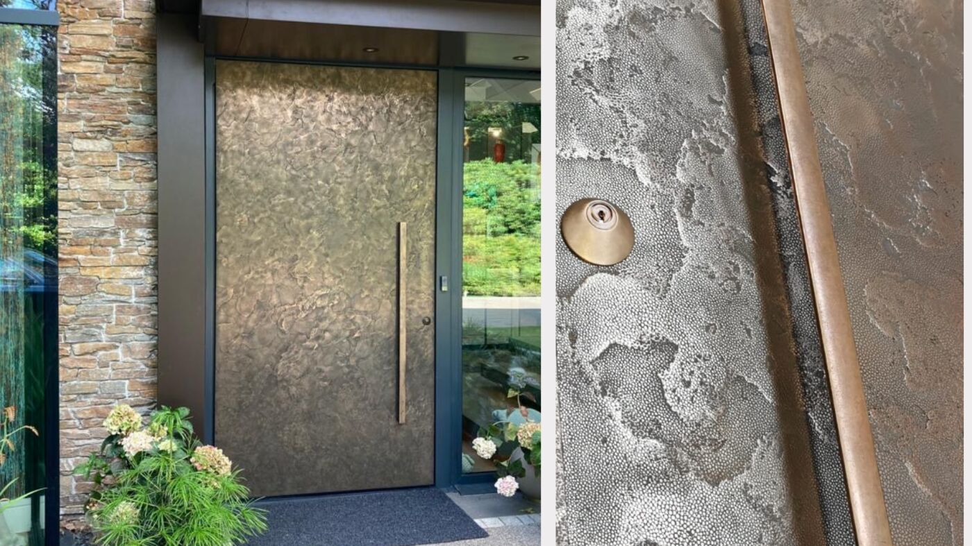 Bronze door in a texture 101 finish with a bronze handle