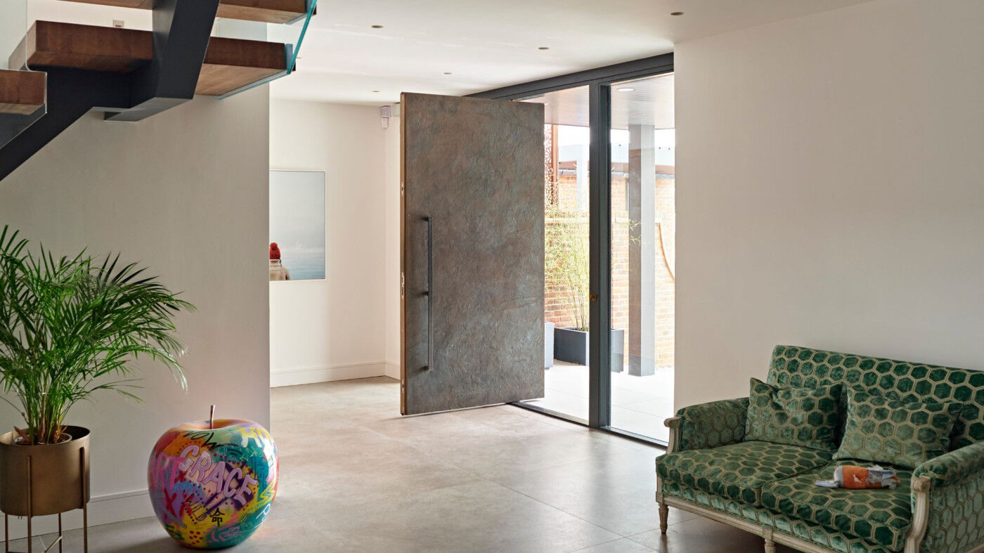 Bronze pivot  front door in our 101 finish