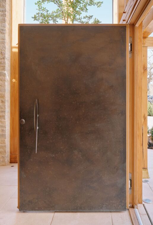 Bronze door with oak frame