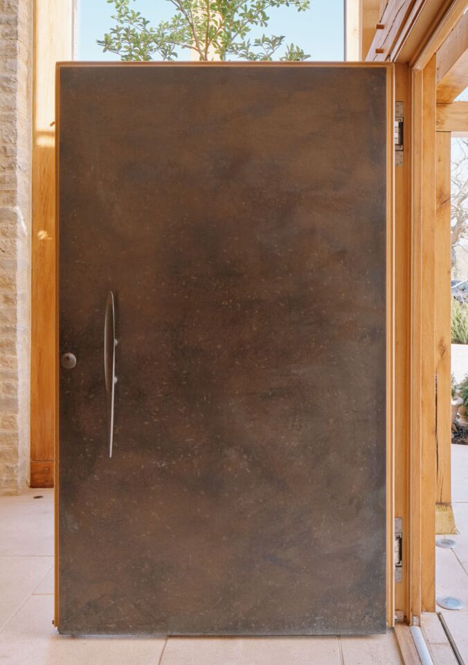 Bronze door with oak frame