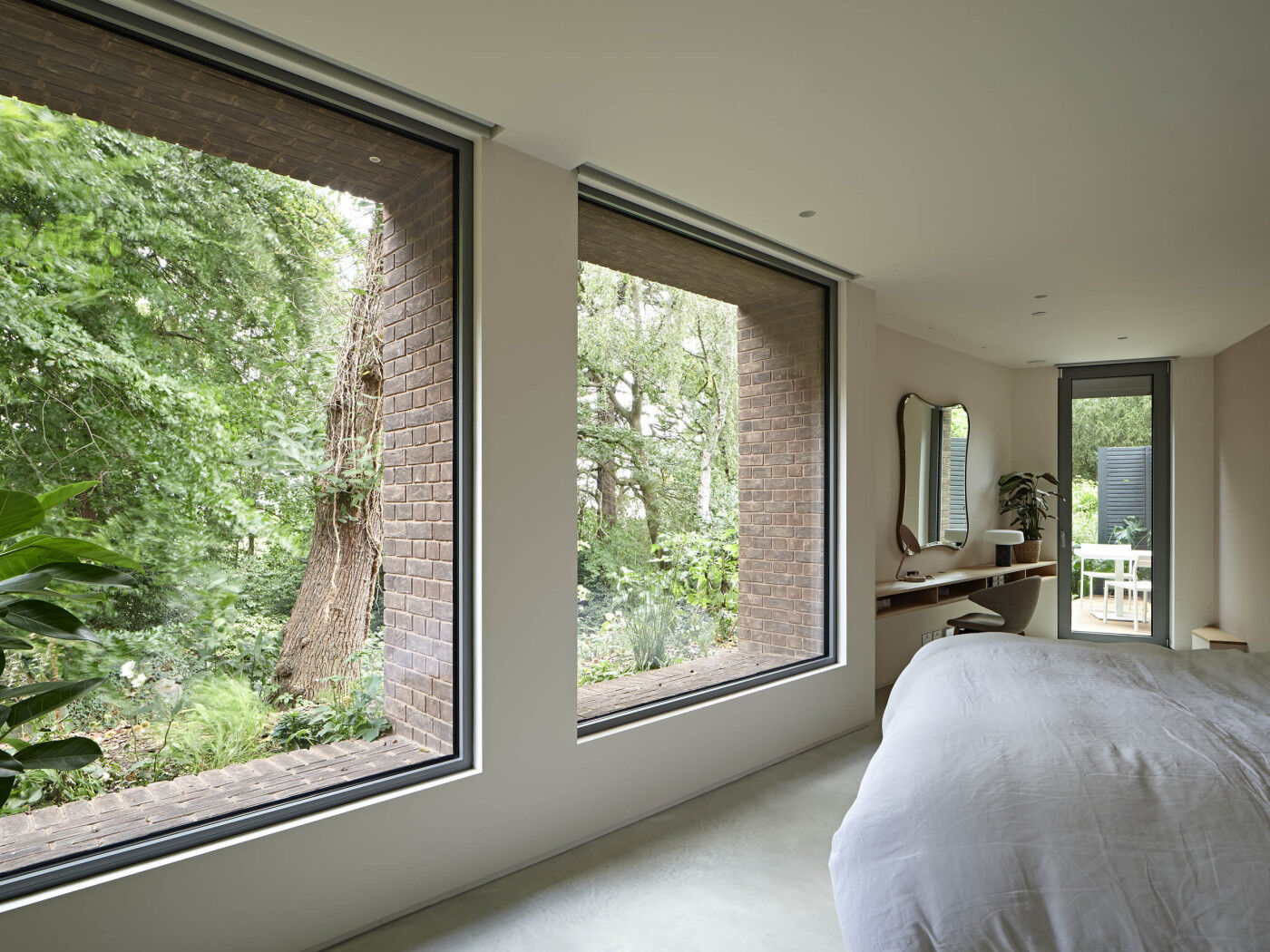 The awkward angles of the first floor were used to the maximum with plenty of light opening up the space (bedroom by Case Furniture)