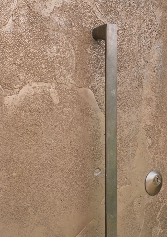 Portrait Cuttle Brook Barn close up of bronze finish and handle