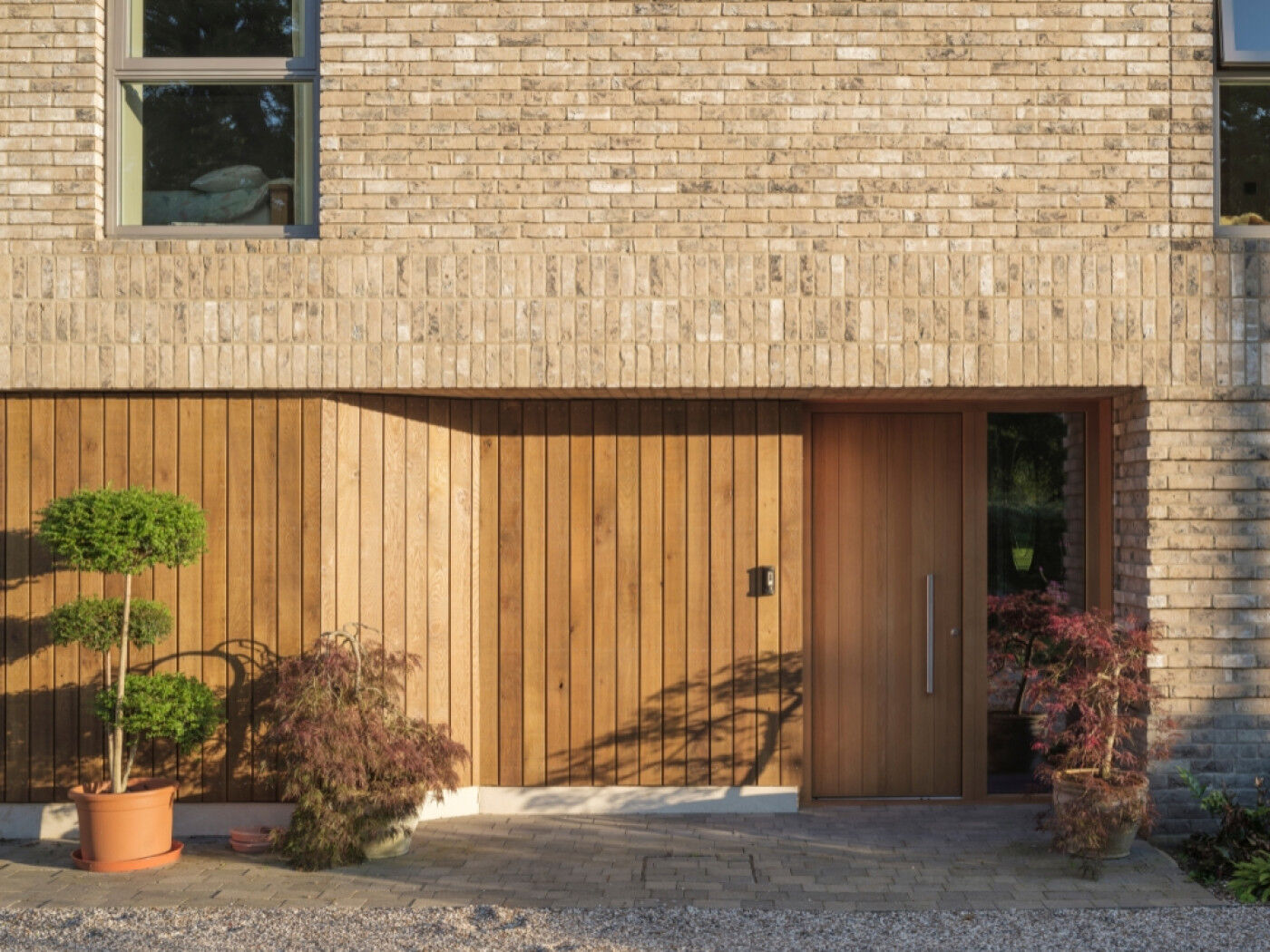 Long House with a Passive front door in oak with matching cladding