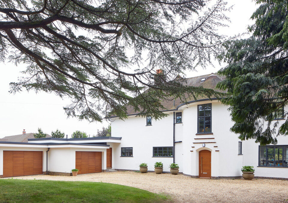 A 1930's house remodelled with matching front and garage doors