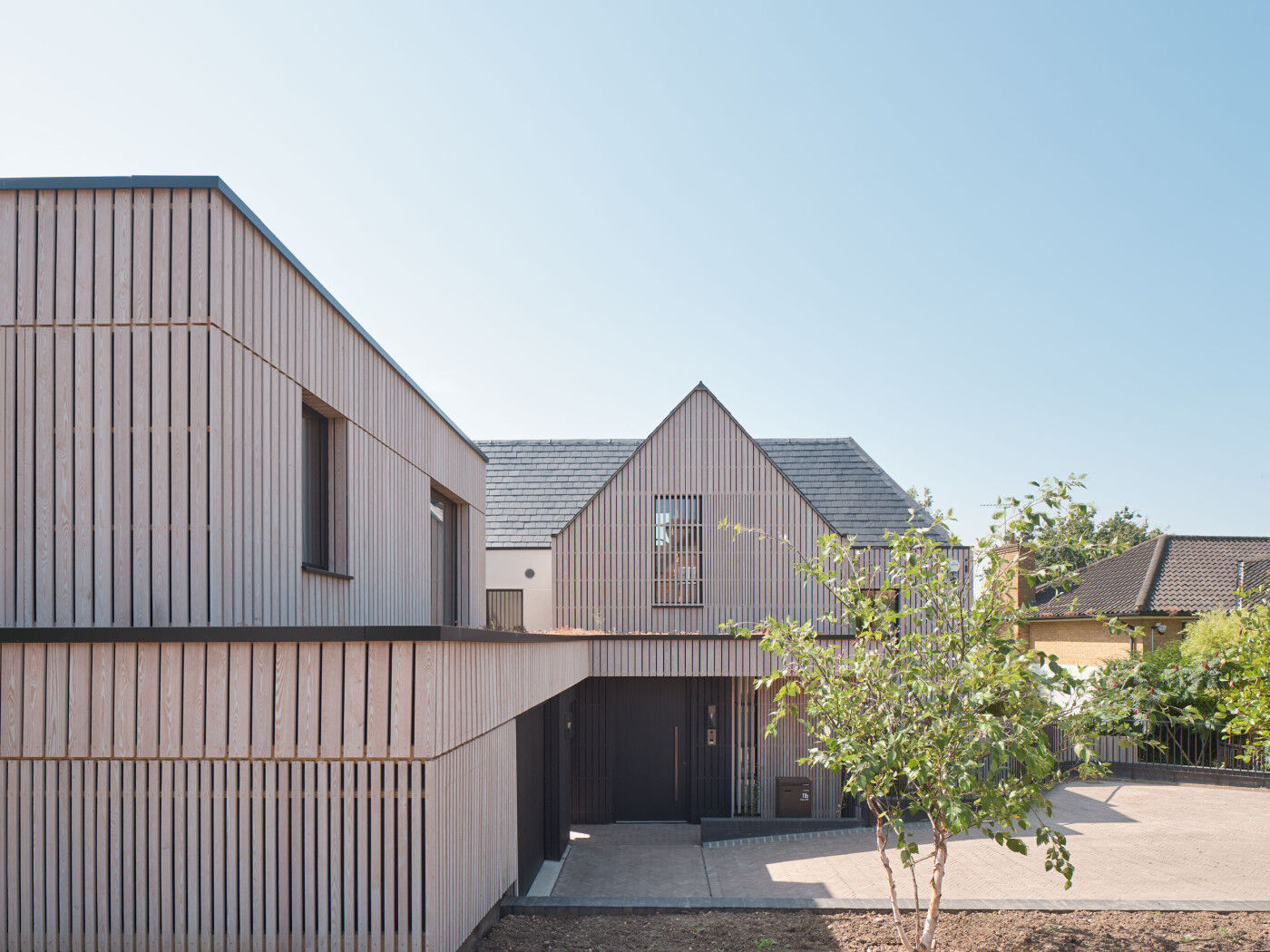 A sustainable home with a Passive door by Urban Front