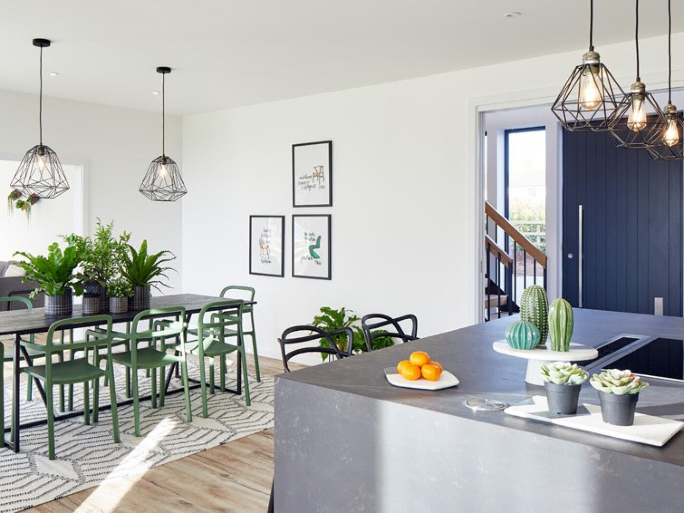 The contemporary feel is continued internally with accents of concrete & green