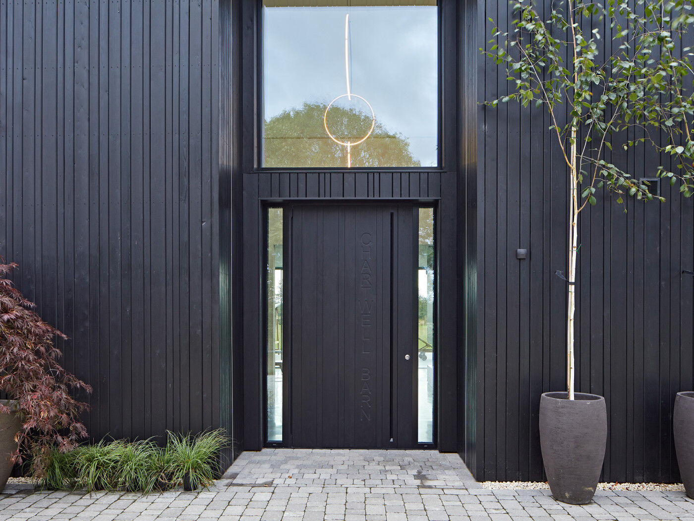 An Urban Front door in ebony oil with matching cladding
