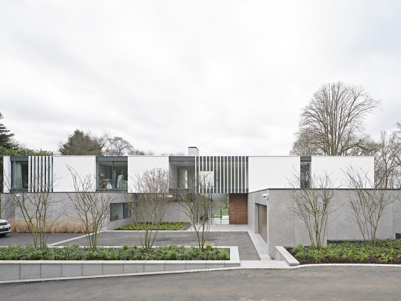 The entrance is ultra impressive when seen in full view, with varying materials & textures adding to the contemporary design