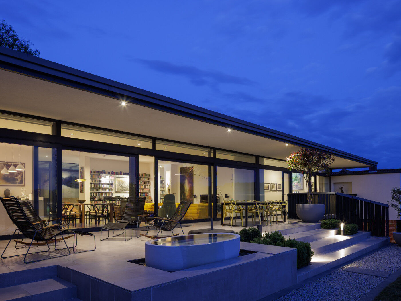 And as night falls, the wide use of glazing throughout lights up from the inside and creates the perfect outside spot to wind down