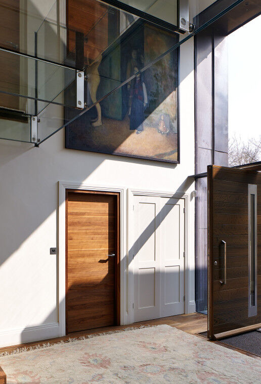 The glass frontage sheds spectacular light on the front and internal doors