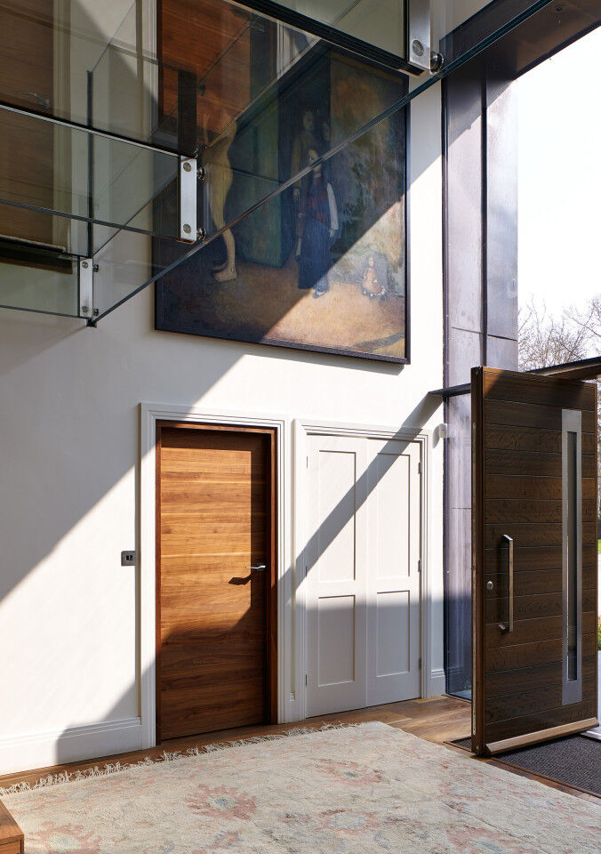 The glass frontage sheds spectacular light on the front and internal doors