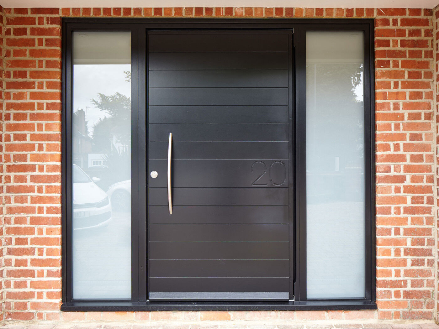 The Numero door design features the house number