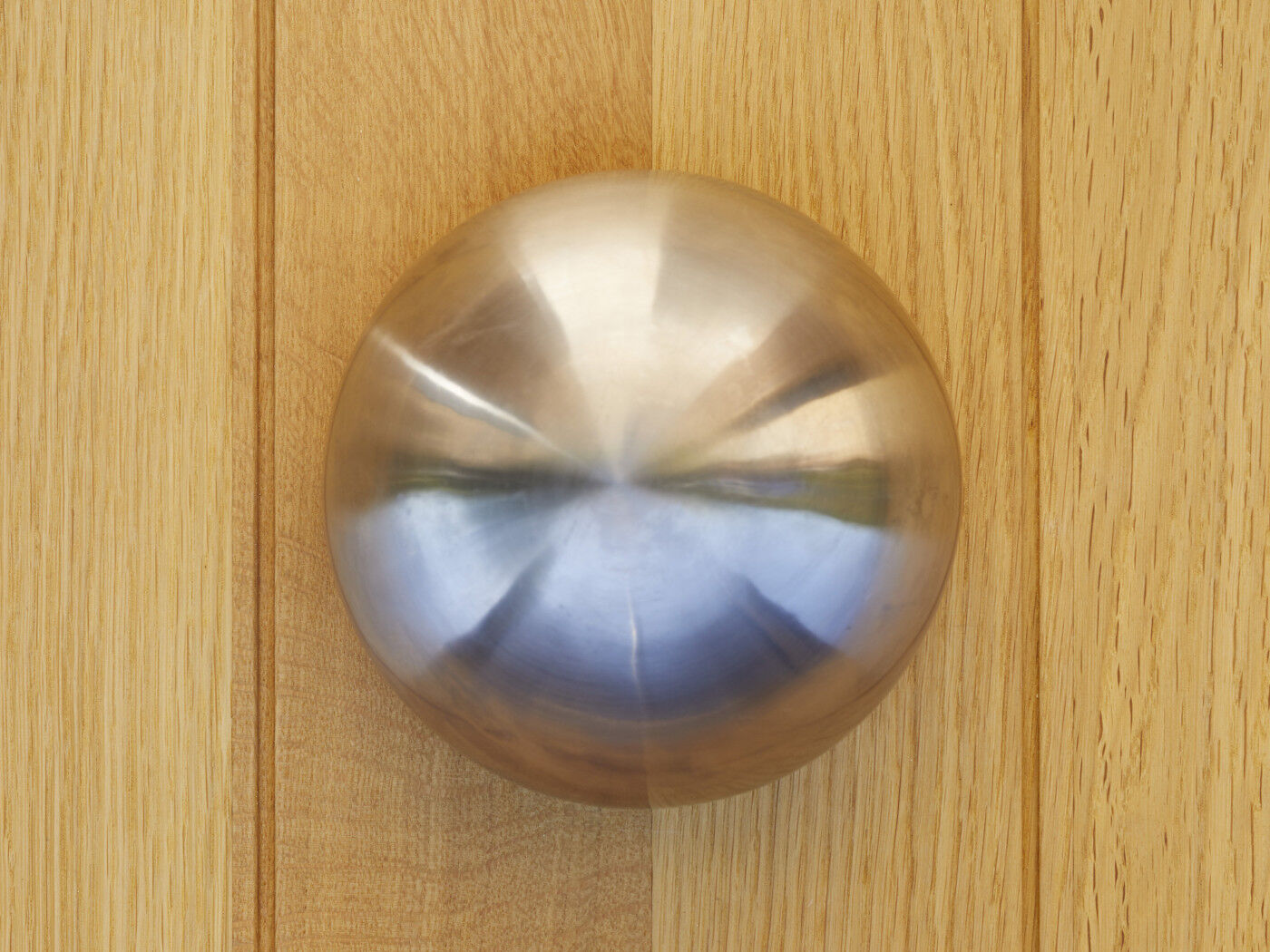 Complementing the look further is the statement round button handle