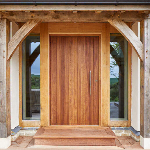 The traditional oak frame contrasts beautifully with the contemporary front door