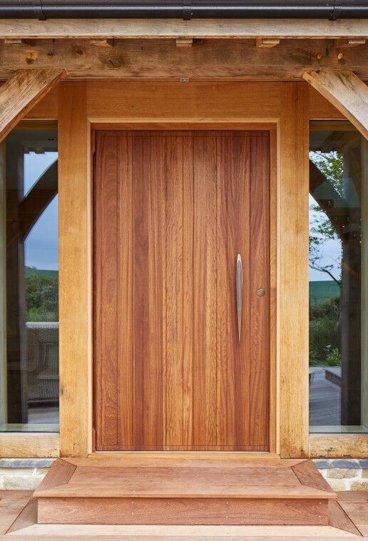 The traditional oak frame contrasts beautifully with the contemporary front door