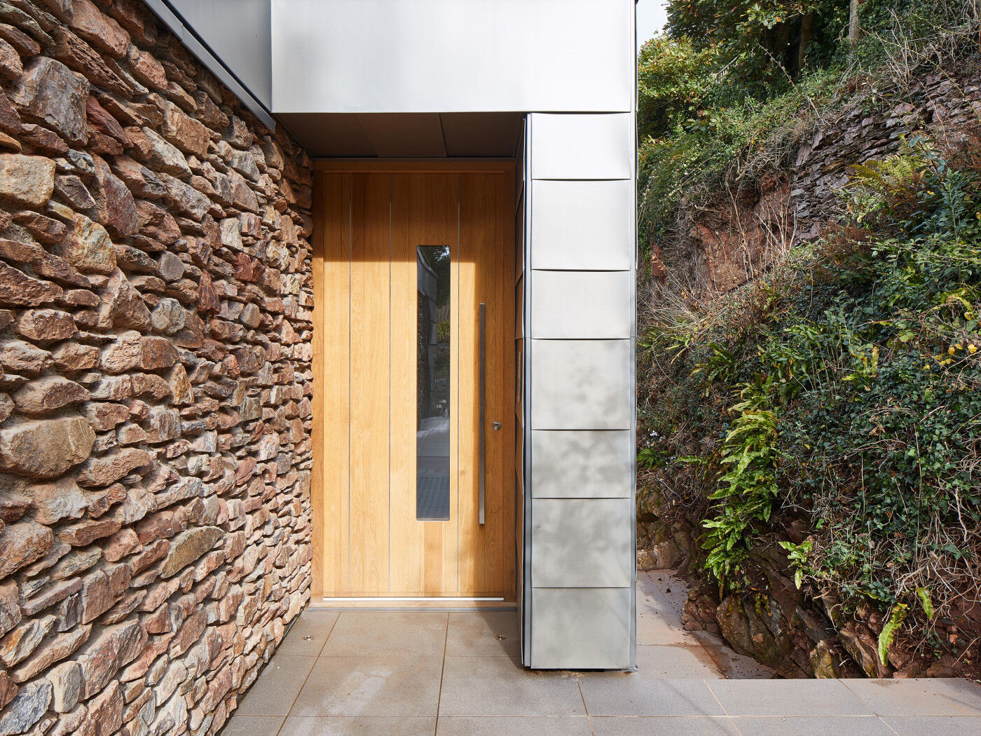 A glass vision panel is a key feature of the Terano front door design