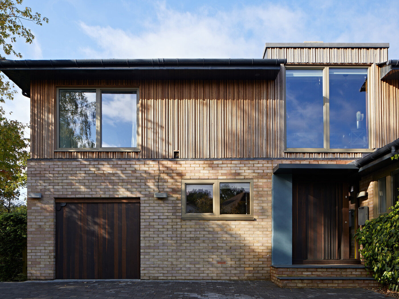 The unequal, iroko cladding was chosen to blend in with the surroundings, with the knowledge that it would start to grey over time