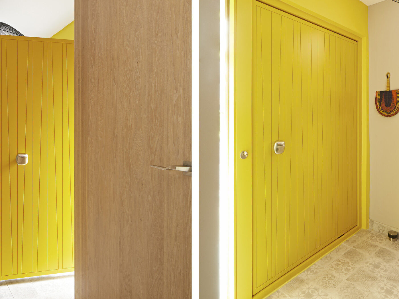 The internal side of this front door is in a milano V design and has been painted yellow