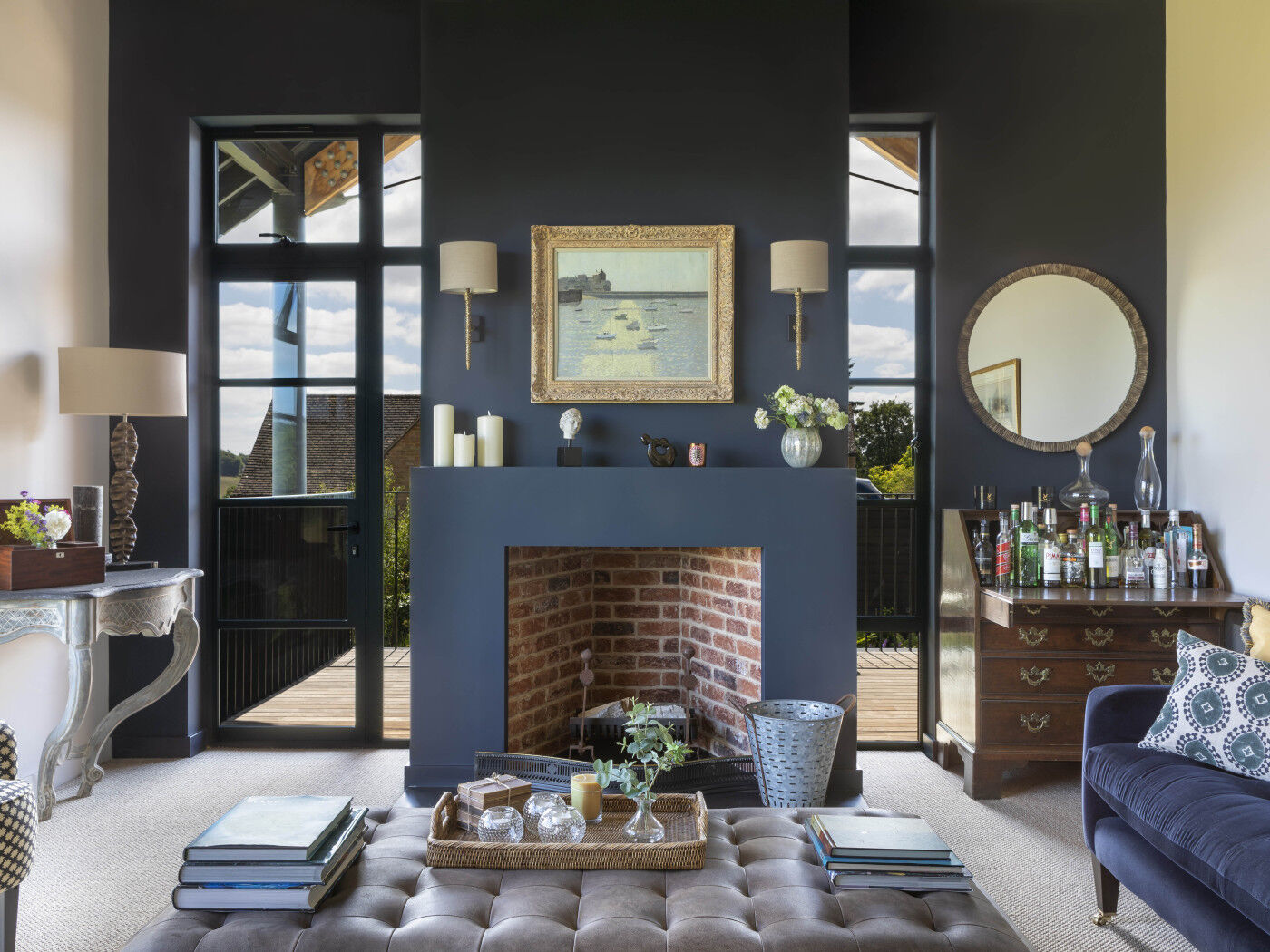 The amount of natural light allows for some darker colours to be used to create warm and cosy resting spaces