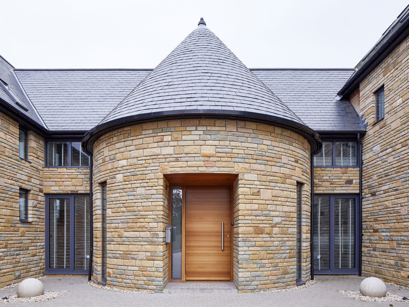Parma doorset in iroko with one glass side panel in sandblasted finish