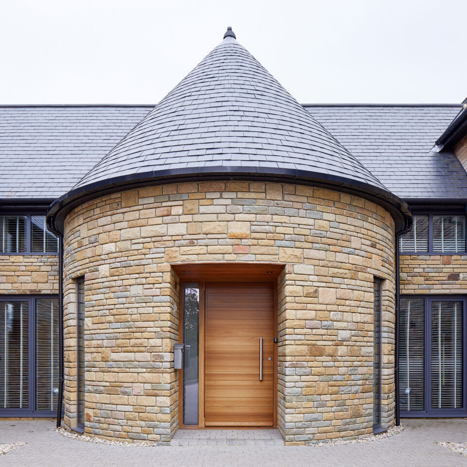 Parma doorset in iroko with one glass side panel in sandblasted finish